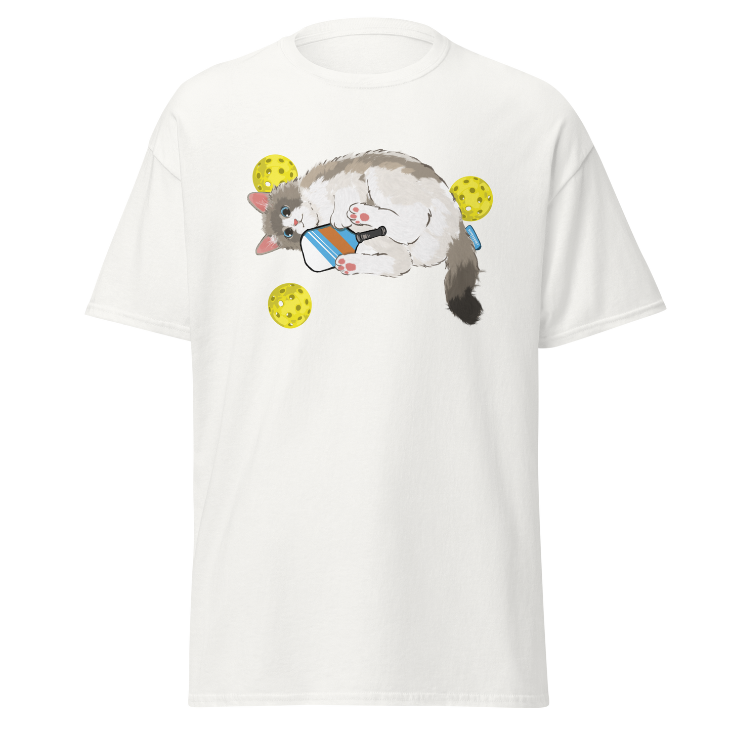 White cat pickleball graphic tee on table, cute sport cat printed shirt for pickleball lovers