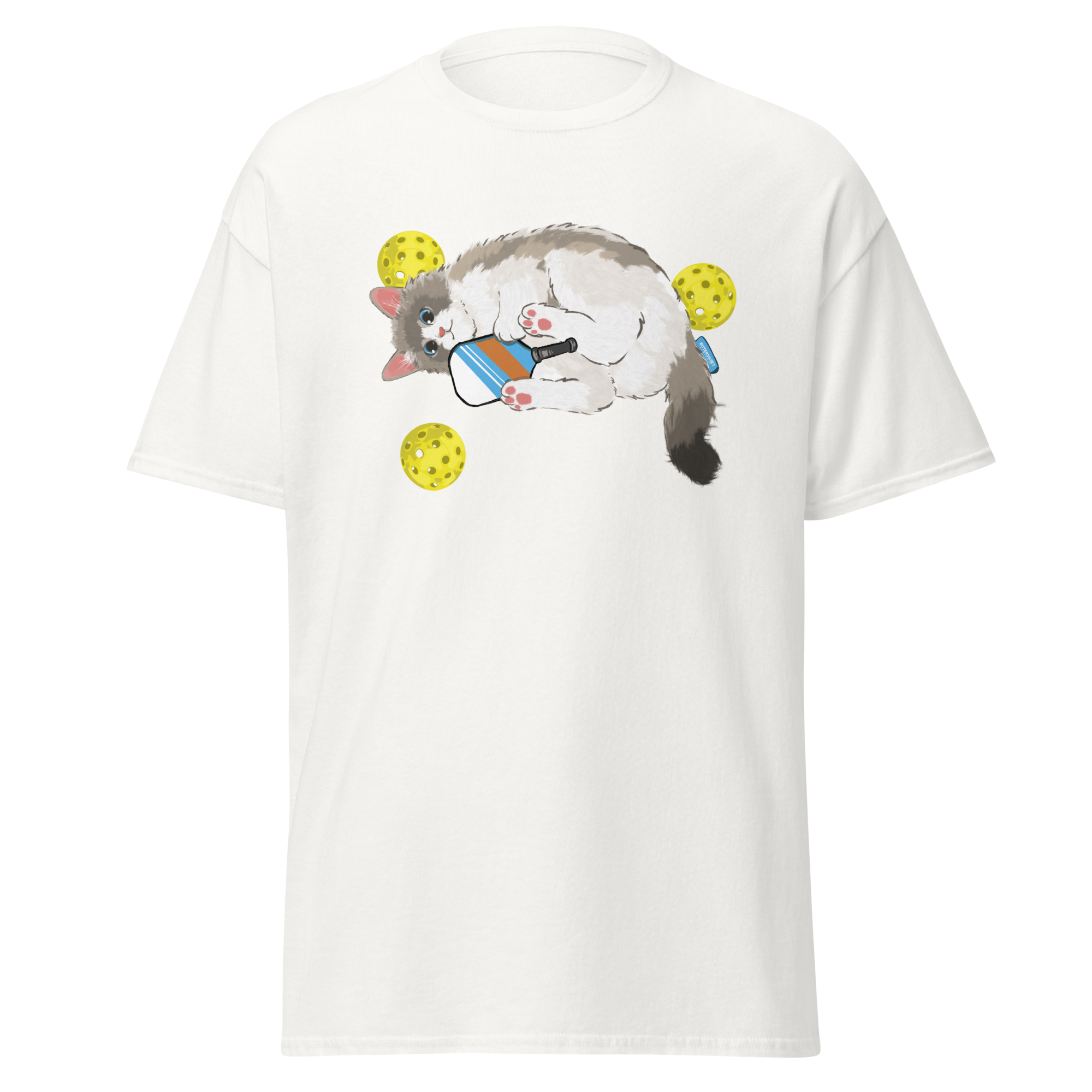 White cat pickleball graphic tee on table, cute sport cat printed shirt for pickleball lovers